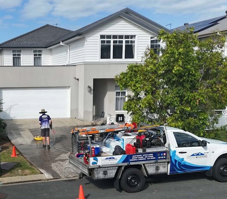 Professional driveway cleaning service at a Brisbane home by House Washing Heroes